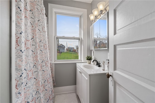 bathroom featuring tile patterned flooring and vanity