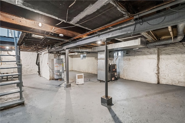 basement featuring heating unit and water heater