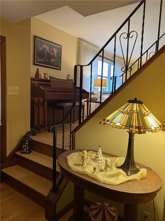 stairway featuring hardwood / wood-style floors