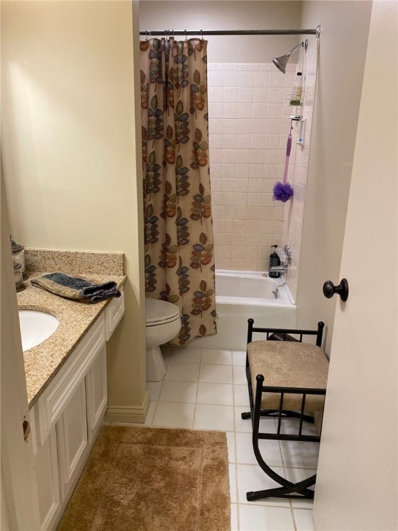 full bathroom featuring tile patterned flooring, vanity, toilet, and shower / tub combo