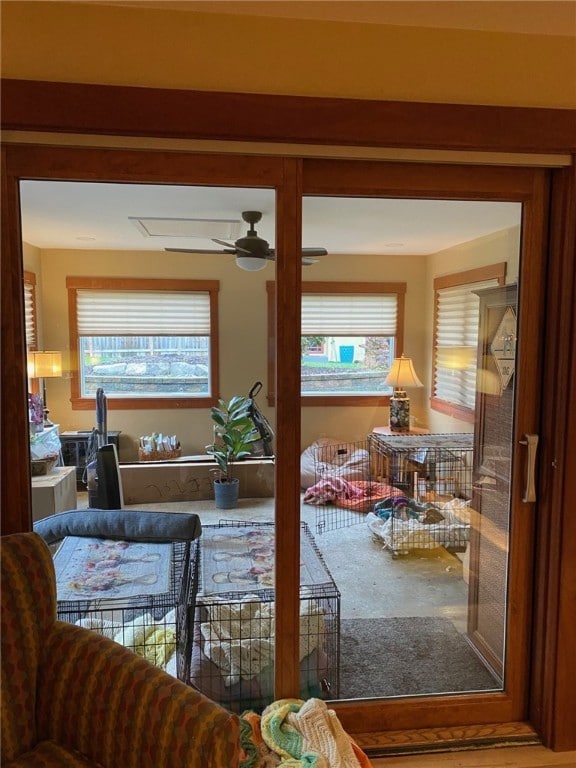 interior space featuring ceiling fan and a healthy amount of sunlight