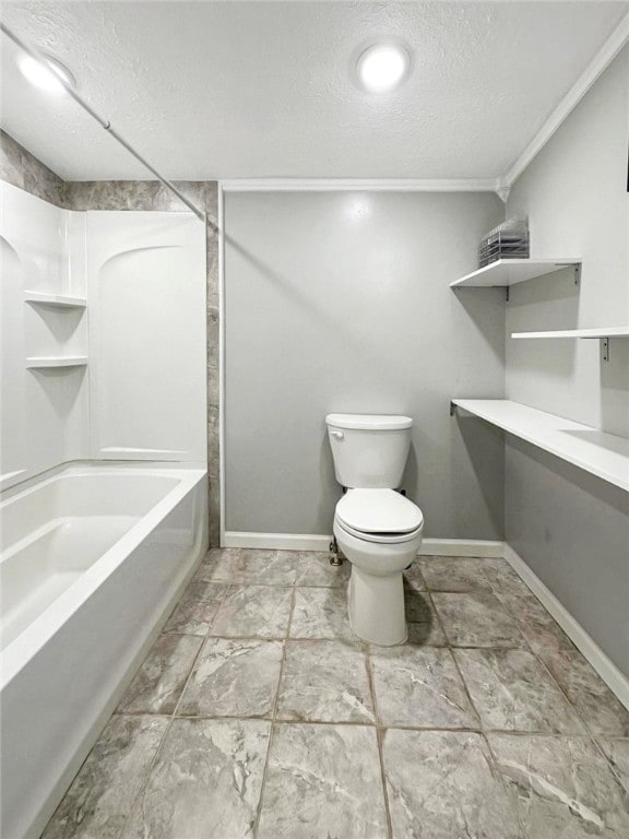 bathroom featuring shower / bath combination, toilet, ornamental molding, and a textured ceiling