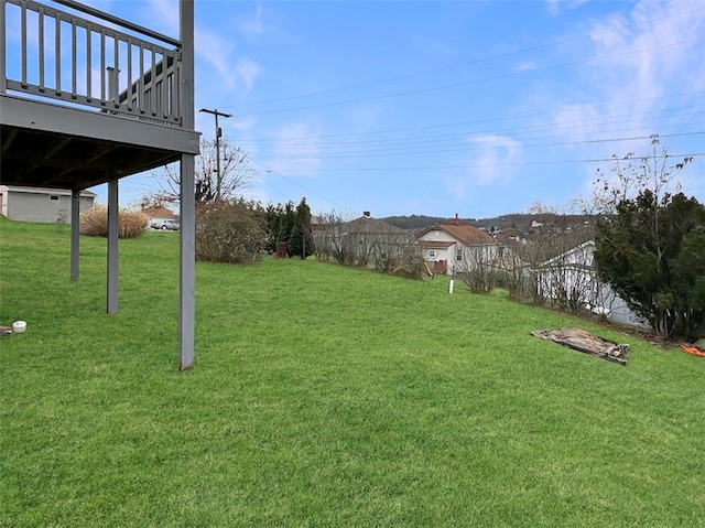 view of yard with a wooden deck