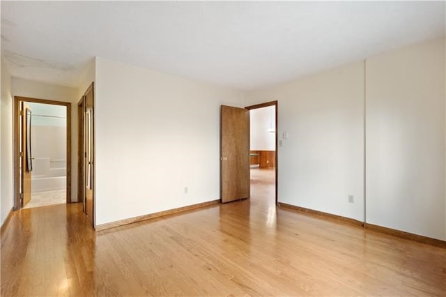 spare room with light wood-type flooring