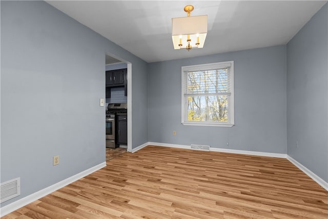 unfurnished dining area featuring hardwood / wood-style flooring