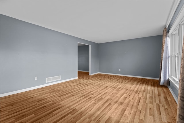 unfurnished room featuring light wood-type flooring