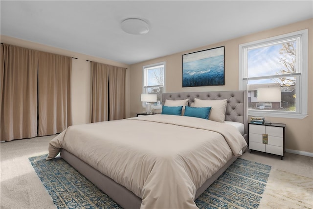 bedroom featuring carpet floors and multiple windows