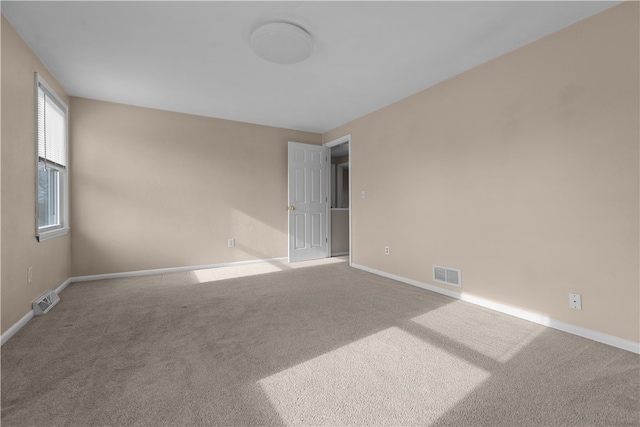 spare room featuring carpet flooring