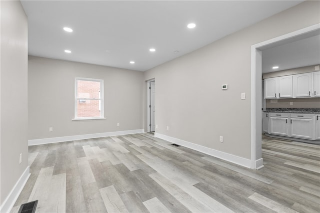 unfurnished room featuring light hardwood / wood-style flooring