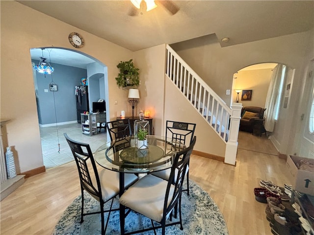 dining area featuring light hardwood / wood-style flooring and ceiling fan