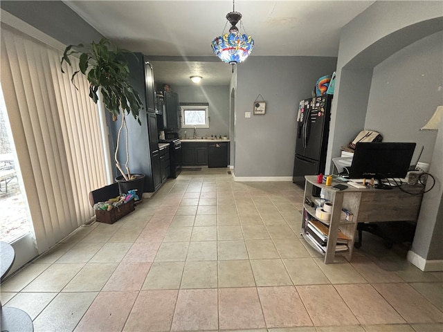 interior space featuring sink and light tile patterned floors