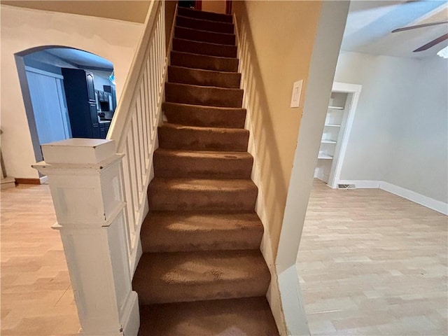1713 W 8th St, Patterson Twp, PA 15010 - staircase featuring wood finished floors, a ceiling fan, and arched walkways