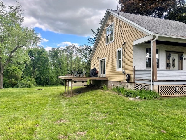 1713 W 8th St, Patterson Twp, PA 15010 - view of property exterior featuring a yard, a shingled roof, and a wooden deck