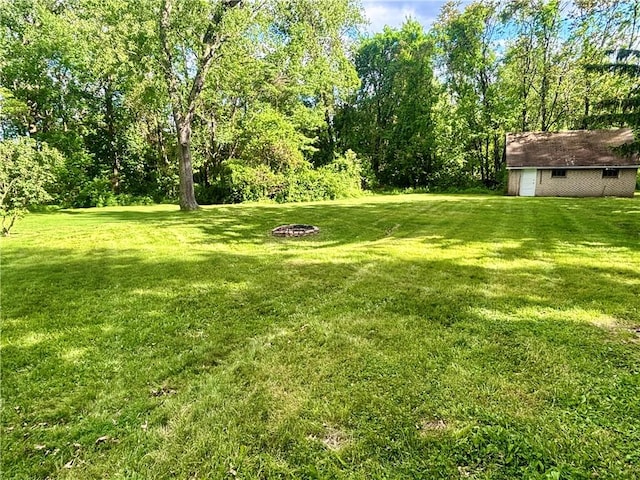 1713 W 8th St, Patterson Twp, PA 15010 - view of grassy yard featuring an outdoor fire pit