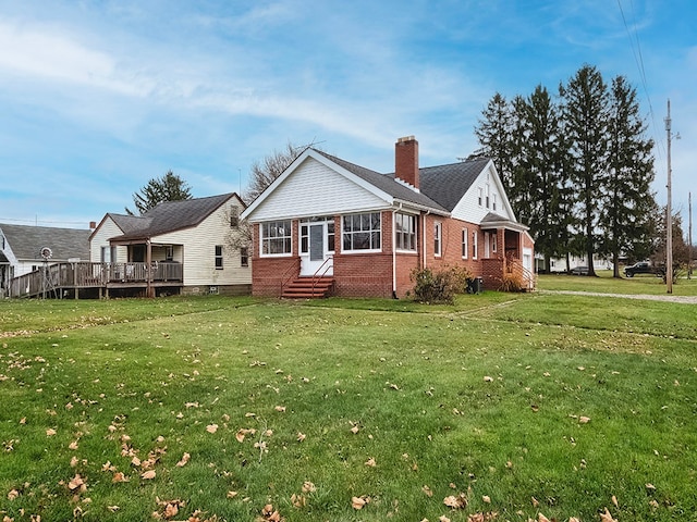 rear view of house with a lawn