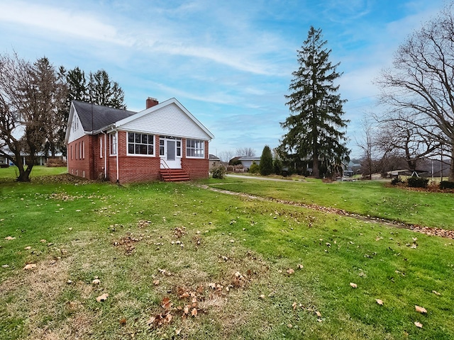 view of home's exterior with a yard