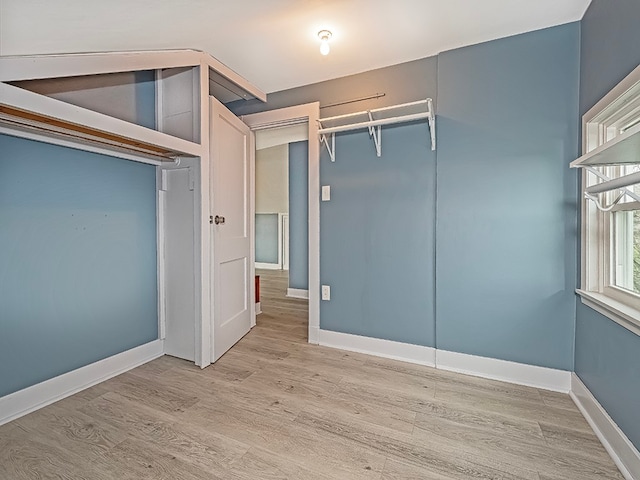 walk in closet featuring light hardwood / wood-style flooring