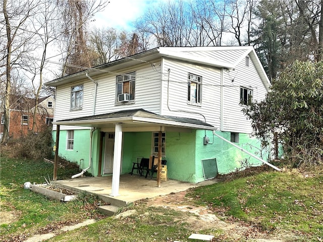 back of property with covered porch