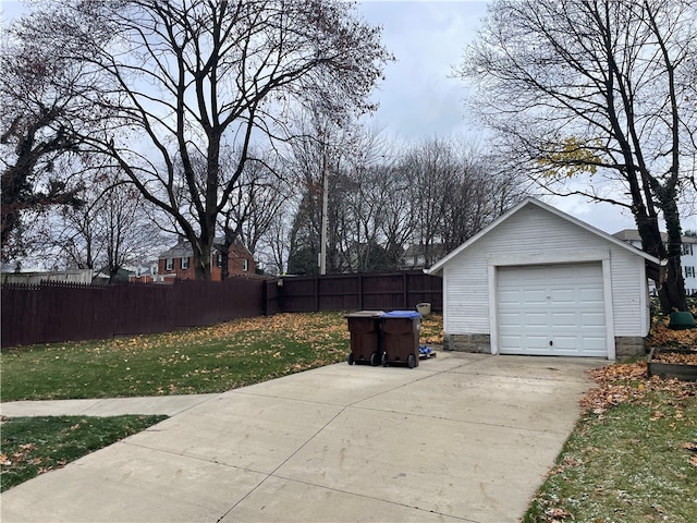 garage featuring a lawn