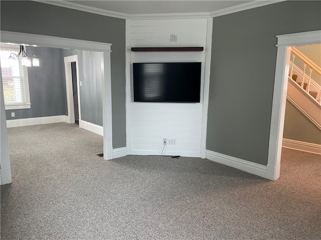 unfurnished living room with crown molding, carpet, and a chandelier