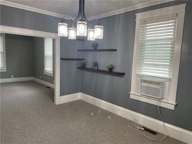 unfurnished dining area with cooling unit, carpet floors, crown molding, and an inviting chandelier