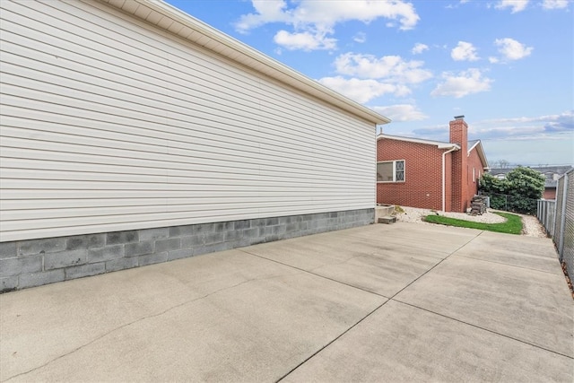 view of side of home featuring a patio area