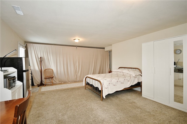 bedroom featuring carpet