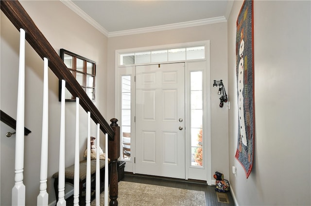 foyer entrance featuring dark hardwood / wood-style flooring and ornamental molding