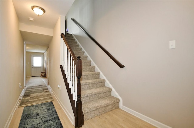 stairway featuring hardwood / wood-style flooring