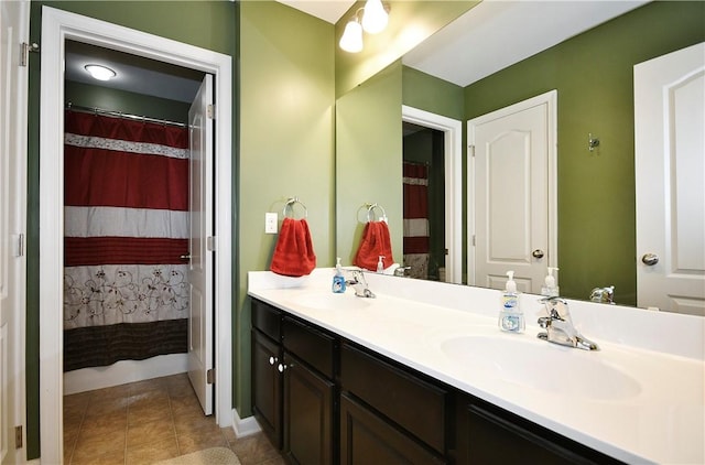 bathroom with tile patterned floors, a shower with curtain, and vanity