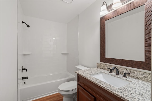 full bathroom featuring hardwood / wood-style floors, vanity, shower / bath combination, and toilet