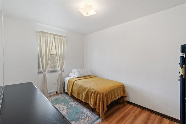 bedroom featuring hardwood / wood-style floors