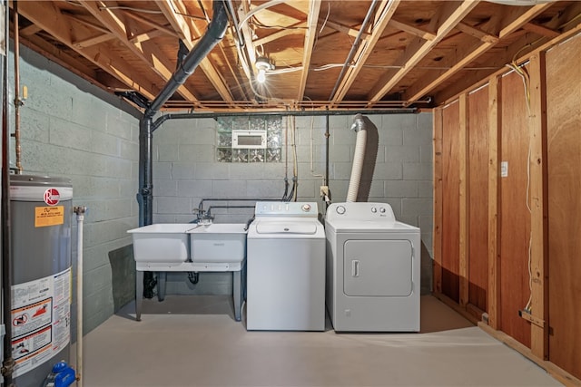 washroom featuring washer and dryer, sink, and water heater