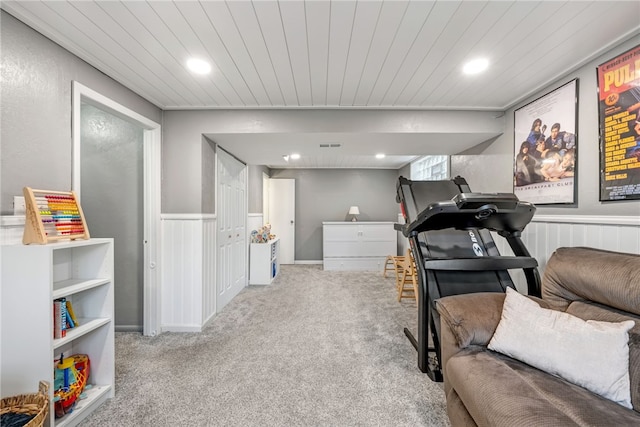 interior space with wood ceiling and light colored carpet