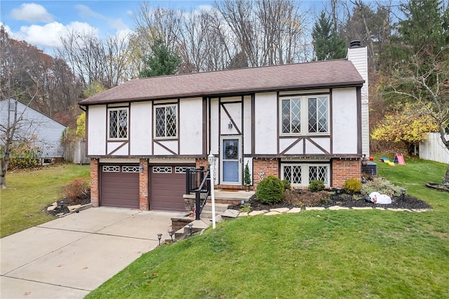 view of front of house featuring a garage and a front lawn