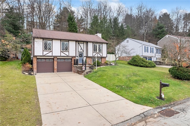 view of front of property featuring a garage and a front lawn