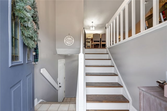 staircase with tile patterned flooring