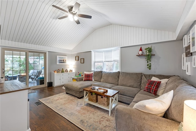 living room featuring vaulted ceiling, a wealth of natural light, ceiling fan, and dark hardwood / wood-style floors