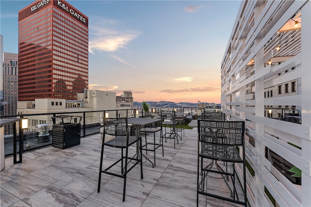 view of patio terrace at dusk