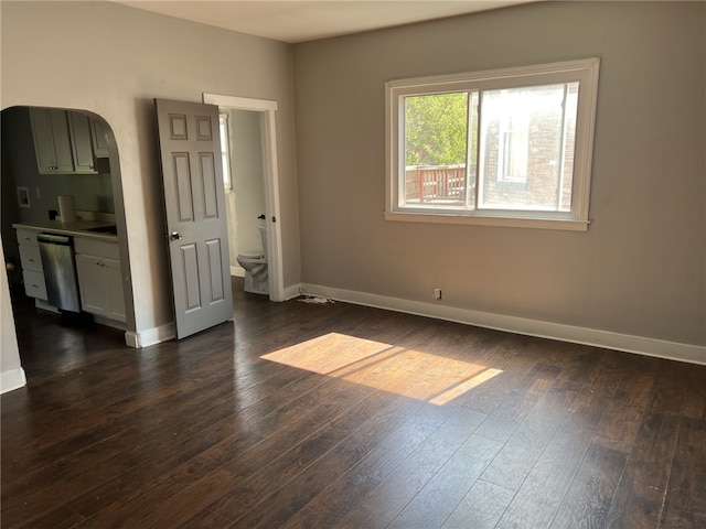 spare room featuring dark hardwood / wood-style flooring