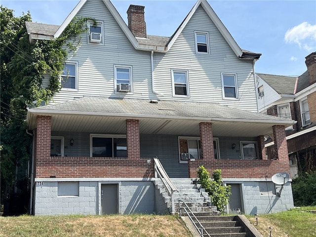 view of front of house featuring a porch and cooling unit