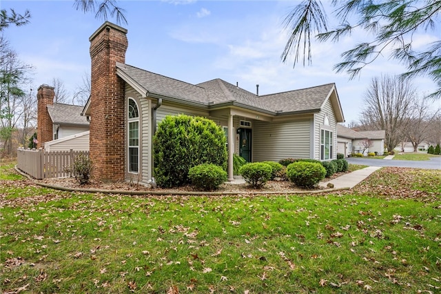 view of property exterior with a yard