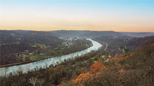 aerial view at dusk with a water view