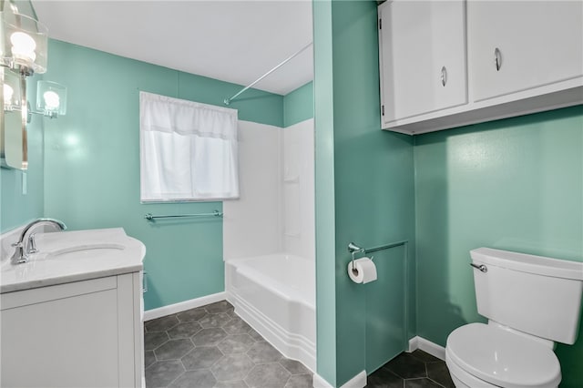 full bathroom with tile patterned floors, bathing tub / shower combination, vanity, and toilet