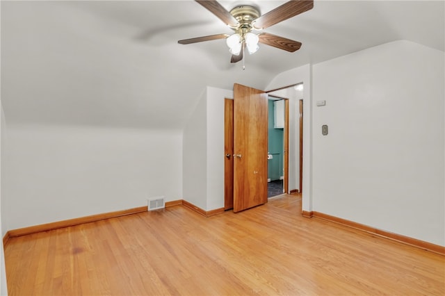 bonus room featuring ceiling fan, light hardwood / wood-style floors, and vaulted ceiling