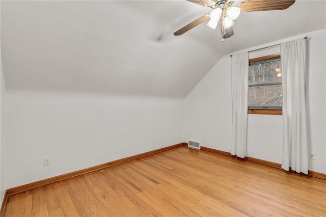 bonus room with light hardwood / wood-style floors, ceiling fan, and lofted ceiling