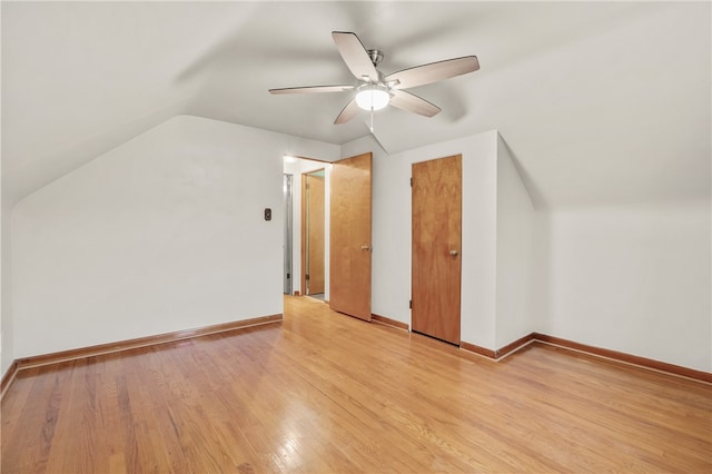 additional living space featuring ceiling fan, lofted ceiling, and light hardwood / wood-style flooring