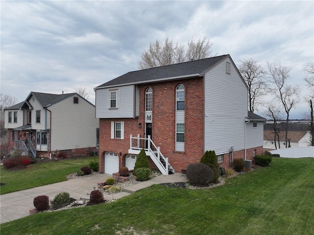 view of front property with a garage and a front lawn