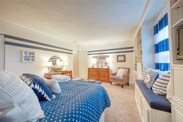 bedroom featuring light carpet, a textured ceiling, and crown molding