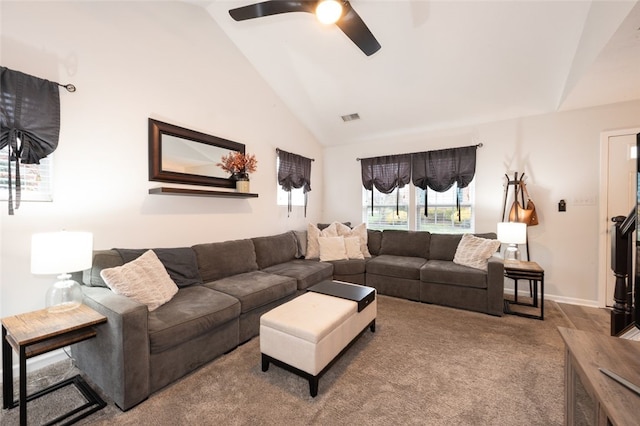 carpeted living room featuring ceiling fan and high vaulted ceiling